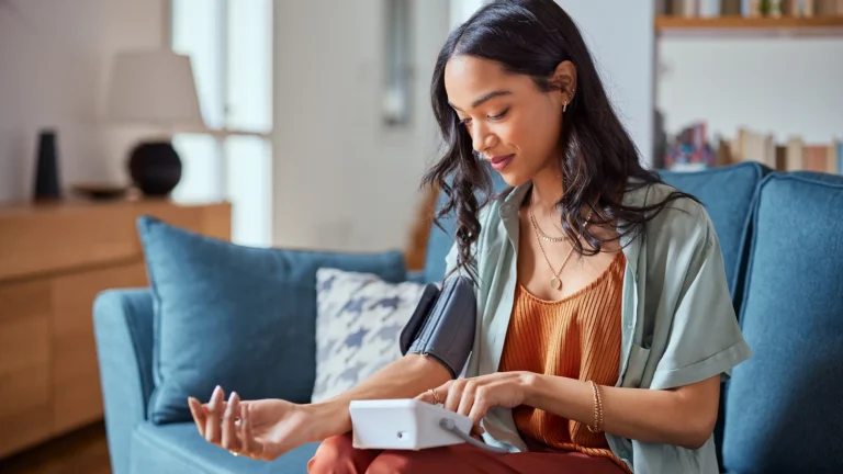 Patient using a medical device at home, showcasing Celero’s support for decentralised clinical trials and innovative healthcare solutions.