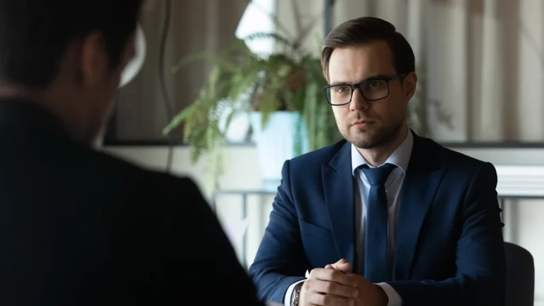 Professional consultant in a strategy meeting, discussing business transformation and innovative solutions for Zain telecommunications.