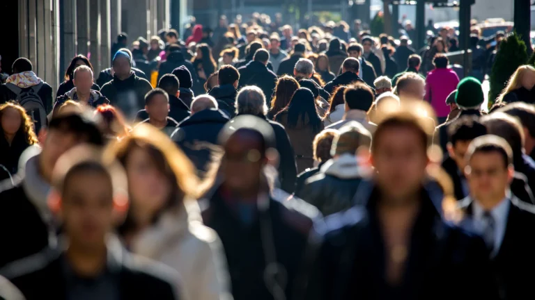 A bustling city crowd, representing the dynamic nature of urban connectivity.