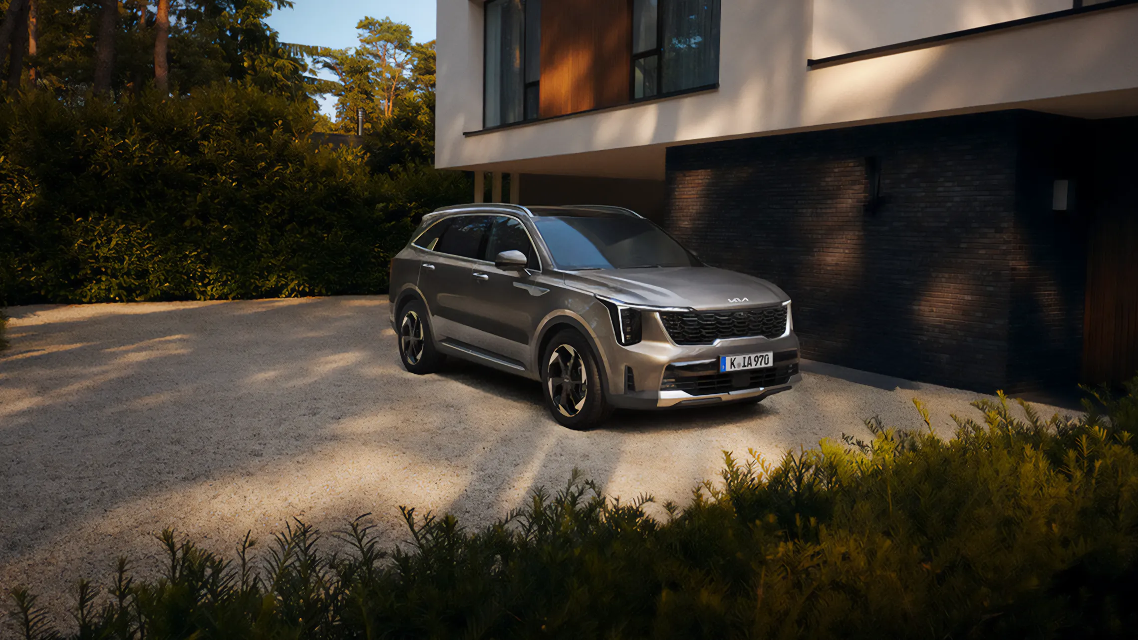 Kia SUV parked in a luxury driveway, emphasising sophistication and modern design.