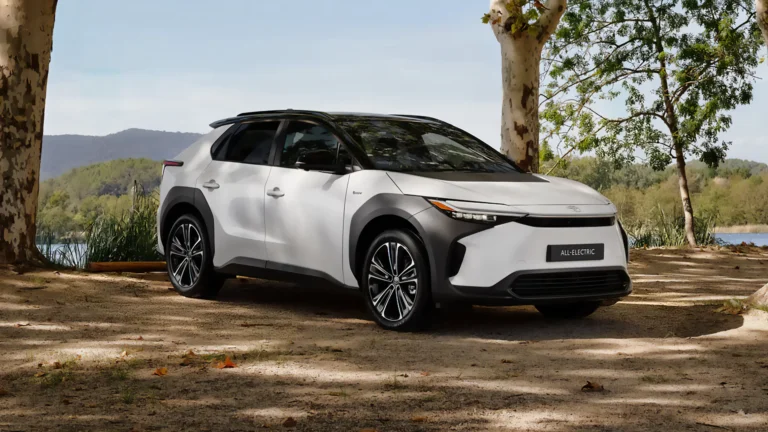 Toyota’s all-electric SUV parked in a serene outdoor setting under a clear sky.