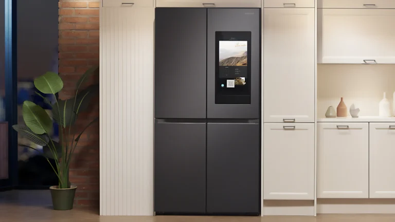 A sleek Samsung Smart Refrigerator installed in a contemporary kitchen with a digital interface on the door.